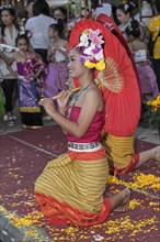 Young woman during a performance with a parasol