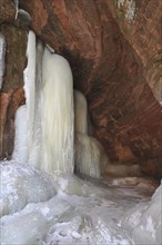 Frozen waterfall inside a cave on the shore of Lake Superior