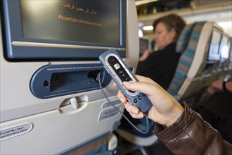 Remote control for operating the in-flight entertainment on a plane