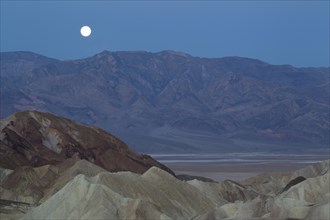 Full moon over the Panamint Range and the Death Valley at dawn