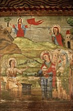 Naive Christian frescoes inside the wooden Church of the Archangels Michael and Gabriel