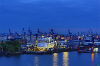 Elbe 17 dry dock of Blohm and Voss with cruise ship AIDAblu at dusk