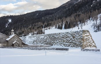 Stone wall as protection against avalanches