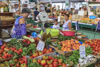 Market stall with fruit and vegetables in the market hall of Sanremo