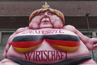 German Chancellor Merkel as a fat Buddha