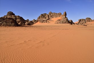 Rocks and sand dunes at Tin Merzouga