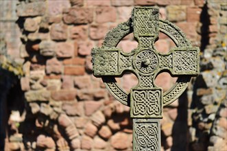 Celtic cross in the ruins of the Benedictine monastery of Lindisfarne