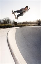 Skateboarder skating in a skate pool