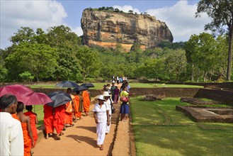 Buddhist monks on their way to the Lion Rock