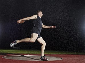 Discus thrower spinning before a throw