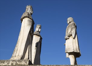 Stone statues of the monarchs Fernando and Isabel on the left and Columbus
