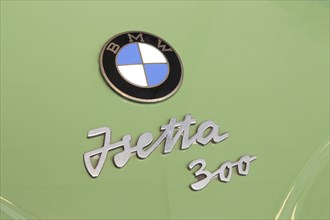 Lettering on a car with logo