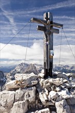 Summit cross of Sextener Rotwand Mountain in the Sexten Dolomites