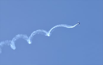 Airplane swirling through the sky