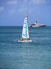 Catamaran and a motor yacht in Rodney Bay