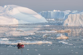 Boat between icebergs