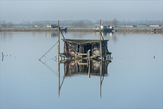 Dilapidated fishing hut in a lagoon