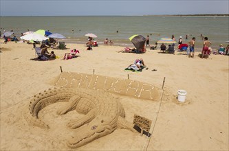 Sand sculpture of a crocodile