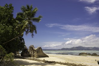 Typical rock formations in the Seychelles with a sandy beach