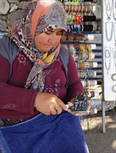 Woman carving a stone