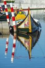 Moliceiro boat anchored on a canal