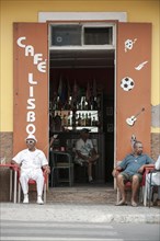 Men sitting in the Lisboa cafe in the historic centre of Mindelo