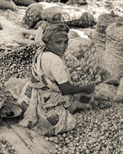 Indian woman sifting onions