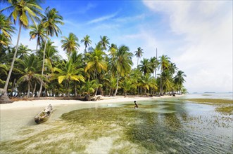 Lonely beach with palm trees on a tropical island