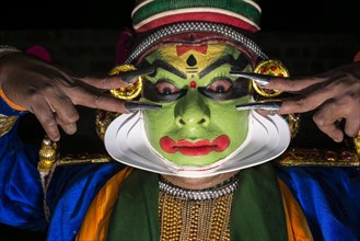 A Katakali with the complete make up of the character Krishna for the Santhana Gopalam play during a temple festival