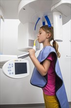 Girl receiving an x-ray of her teeth