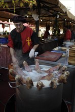 Pigs' feet boiling in a large pot at the annual All Saints Market in Cocentaina