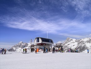 Skiers at the chairlift station