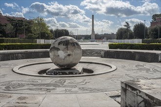 Stone globe and square with marble mosaics