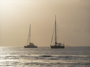 Sailing yachts at twilight near Rodney Bay