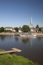 Townscape with Weser river shore and Luther Church