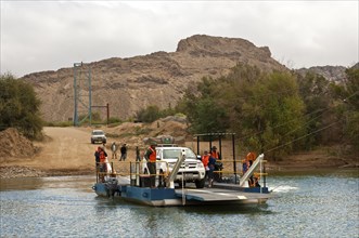 Car on the Octha ferry pontoon across the Orange River between South Africa and Namibia