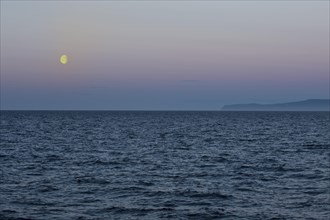 Moon setting over the Bering Strait