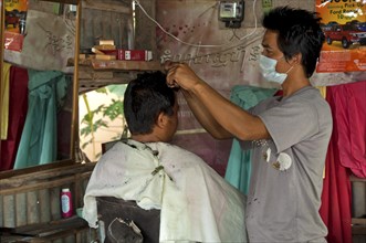Hairdresser cutting a customer's hair at a hair salon