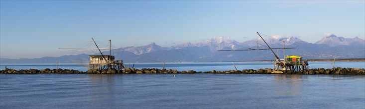 Fisherman's houses with nets over the sea in Marina di Pisa