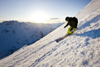 Freeride skier during descent