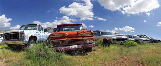 Junk yard with old American cars