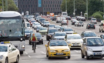 Cyclist and cars in traffic