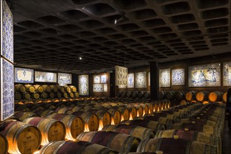 Wine barrels in a cellar decorated with antique azulejos