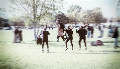 Young people jumping in the air for a snapshot