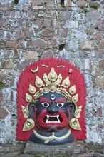 Large brightly painted Tibetan mask of bronze
