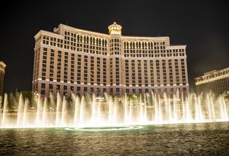 Illuminated fountain in front of the Bellagio Hotel at night
