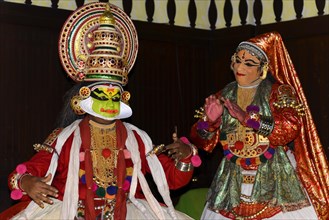 Fully made-up and costumed Kathakali dancers during a performance