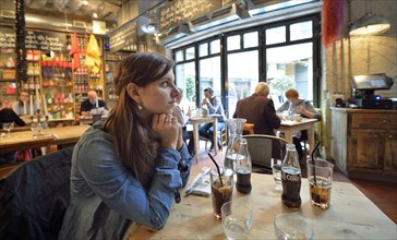 Young woman sitting in a restaurant