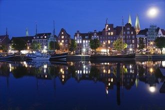 Trave river and the historic centre at full moon