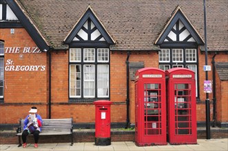 Red telephone booths and a red post box